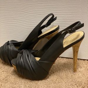 Black Aldo heels with cork accent